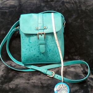 Turquoise tooled design crossbody bag  EUC